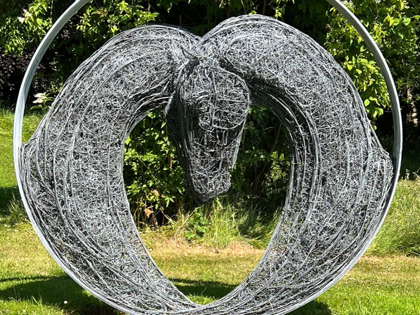 This sculpture was created in 2020 depicting two horse heads to form a heart shape symbol of love drawn and now in a series of paintings by Rupert, too. At 2m diameter or bigger limited to a series